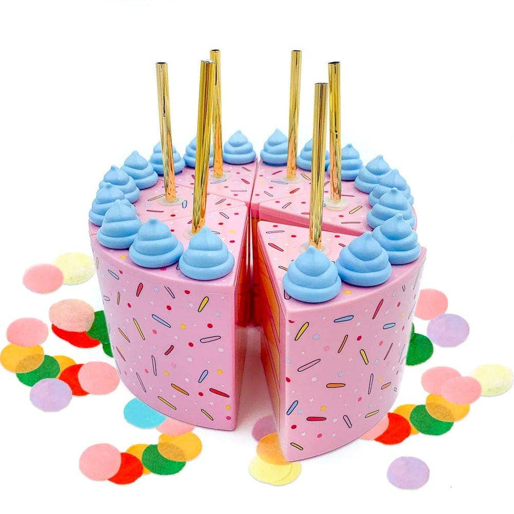 Pink birthday cake sippers with blue frosting and gold candles on a white background