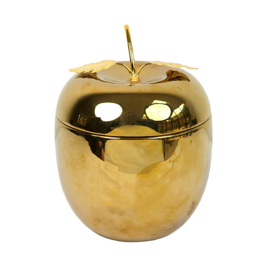 Gold apple-shaped container with a leaf on a white background