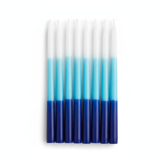 Set of blue and white ombrecandles on a white background