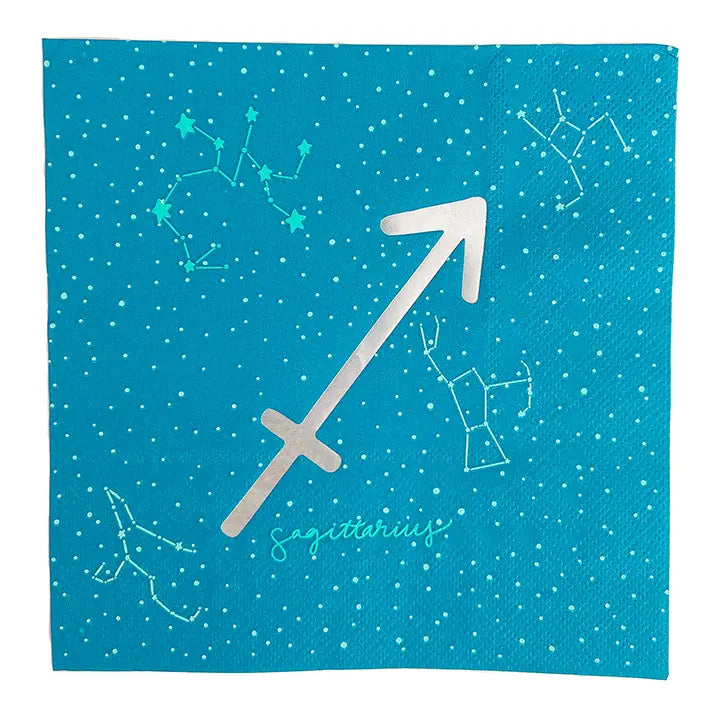 A square blue napkin featuring a silver metallic Sagittarius zodiac symbol, white constellation line drawings, and small white stars on a textured blue background.