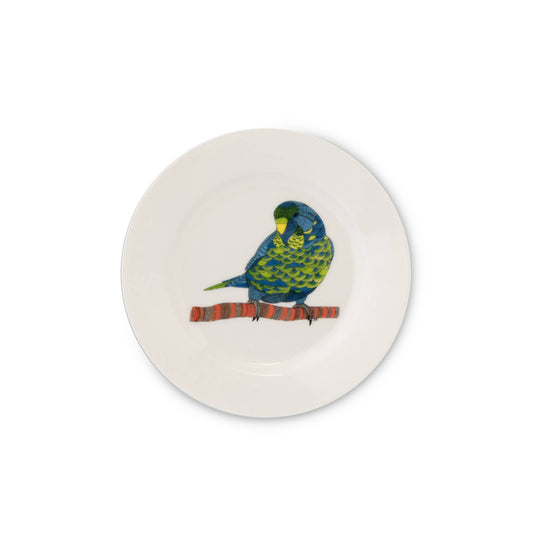 Round ceramic plate with a parrot design on a white background