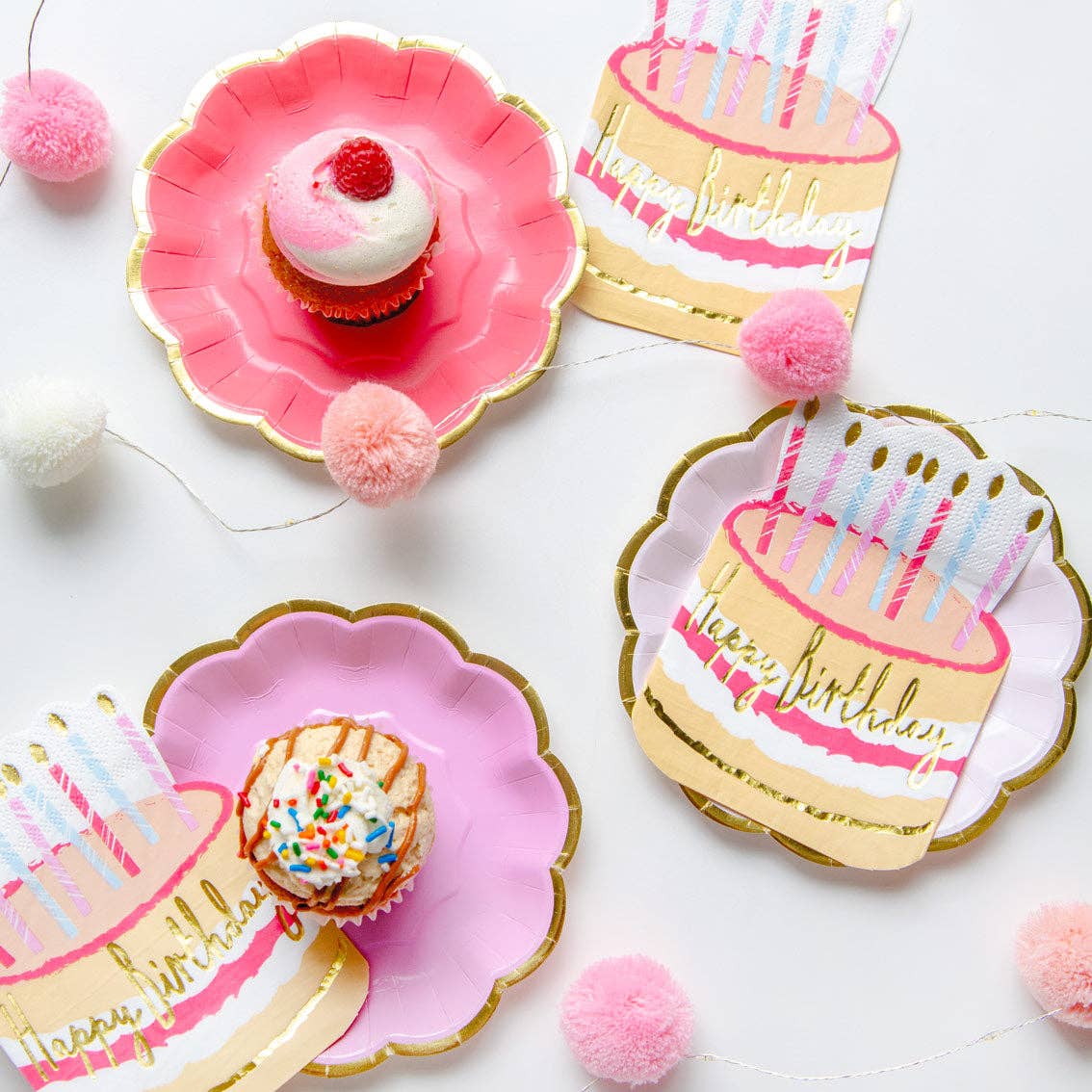 Decorative birthday plates with cake and cupcake designs on a white background.