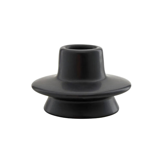 Black ceramic candlestick on a white background
