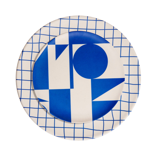 Round ceramic plate with blue geometric design on a white background