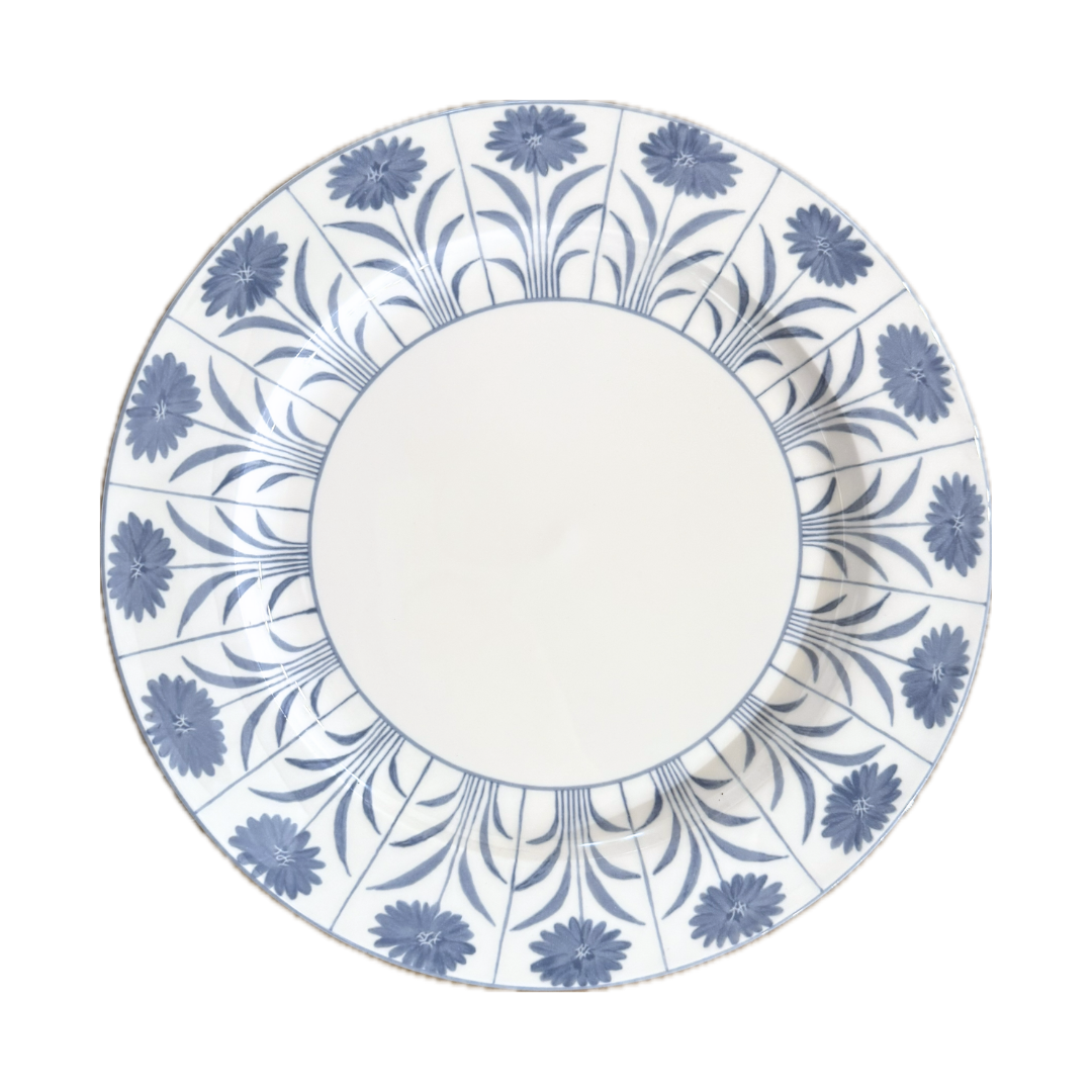Decorative plate with blue floral pattern on a white background