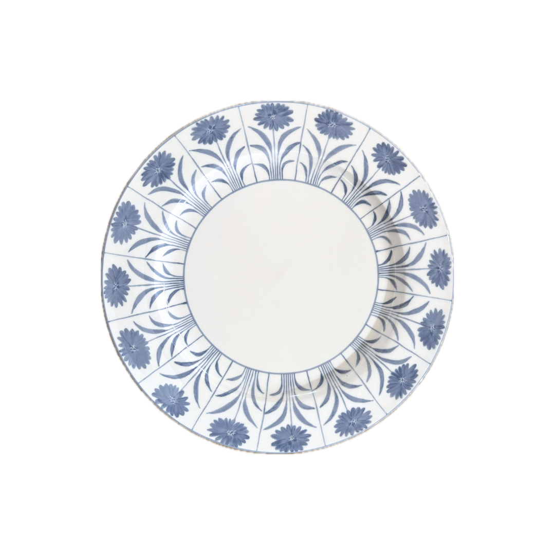 Decorative plate with blue floral pattern on a white background