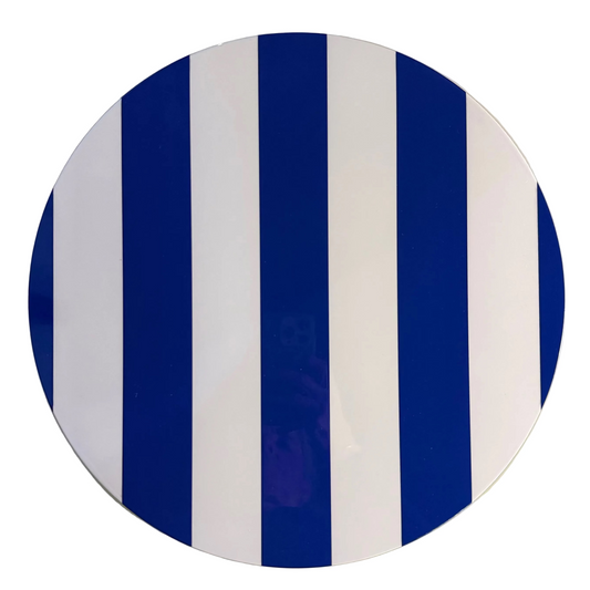 A round decorative placemat featuring bold vertical stripes in deep blue and white, photographed against a plain off-white background.