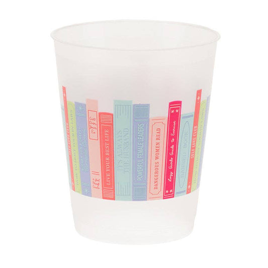 White cup with colorful book spine design on a white background
