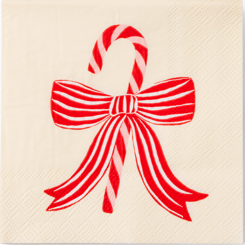 cream napkins with a red bow and candy cane design on a white background