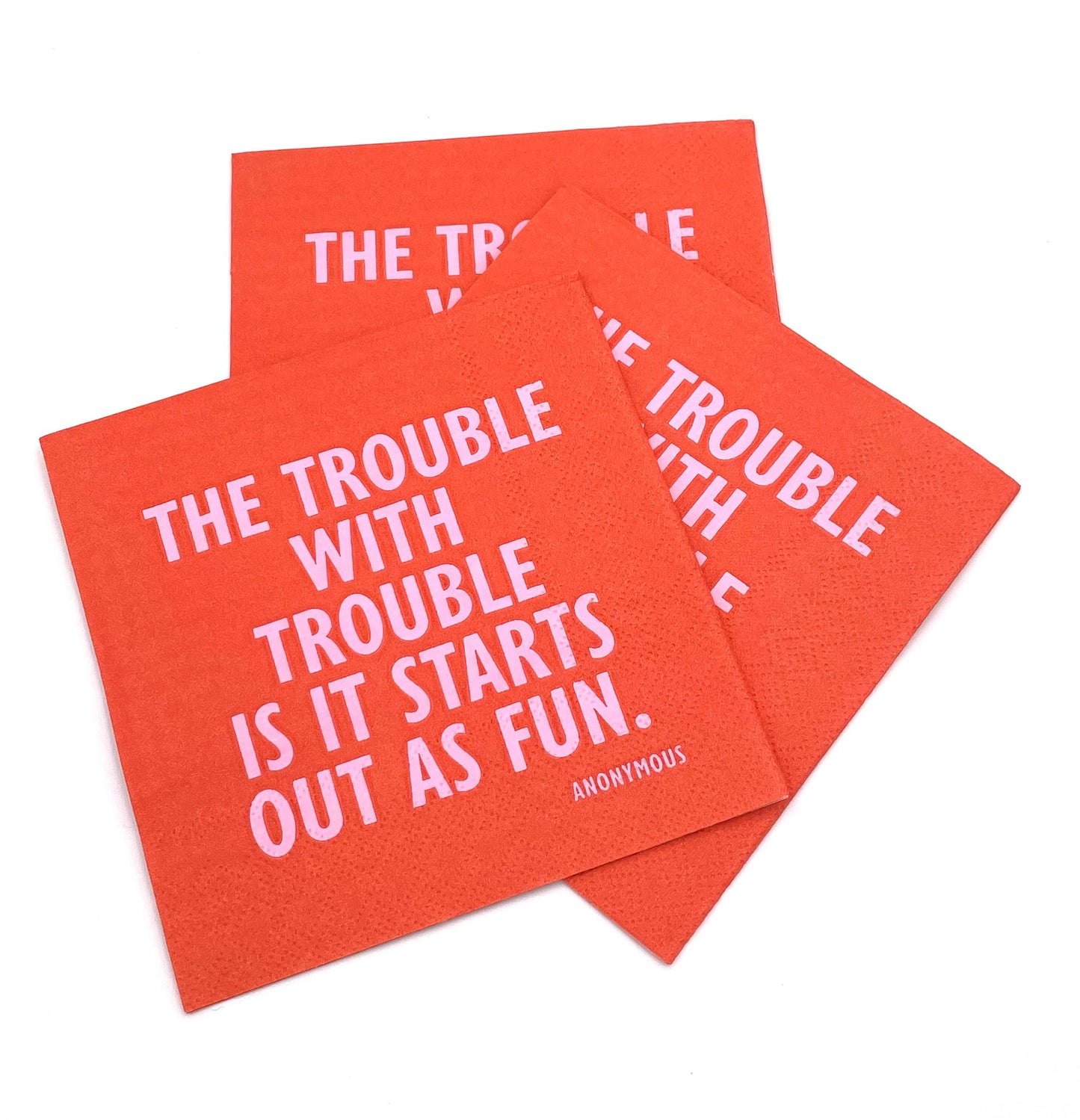 cocktail napkin with text The Trouble with Trouble is it starts out as fun cocktail in pink
