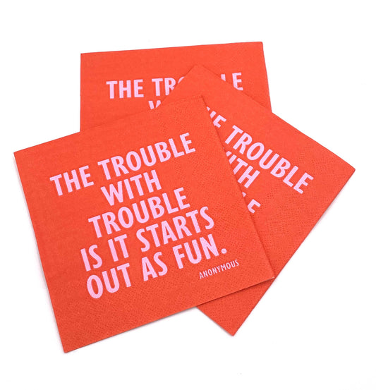 cocktail napkin with text The Trouble with Trouble is it starts out as fun cocktail in pink