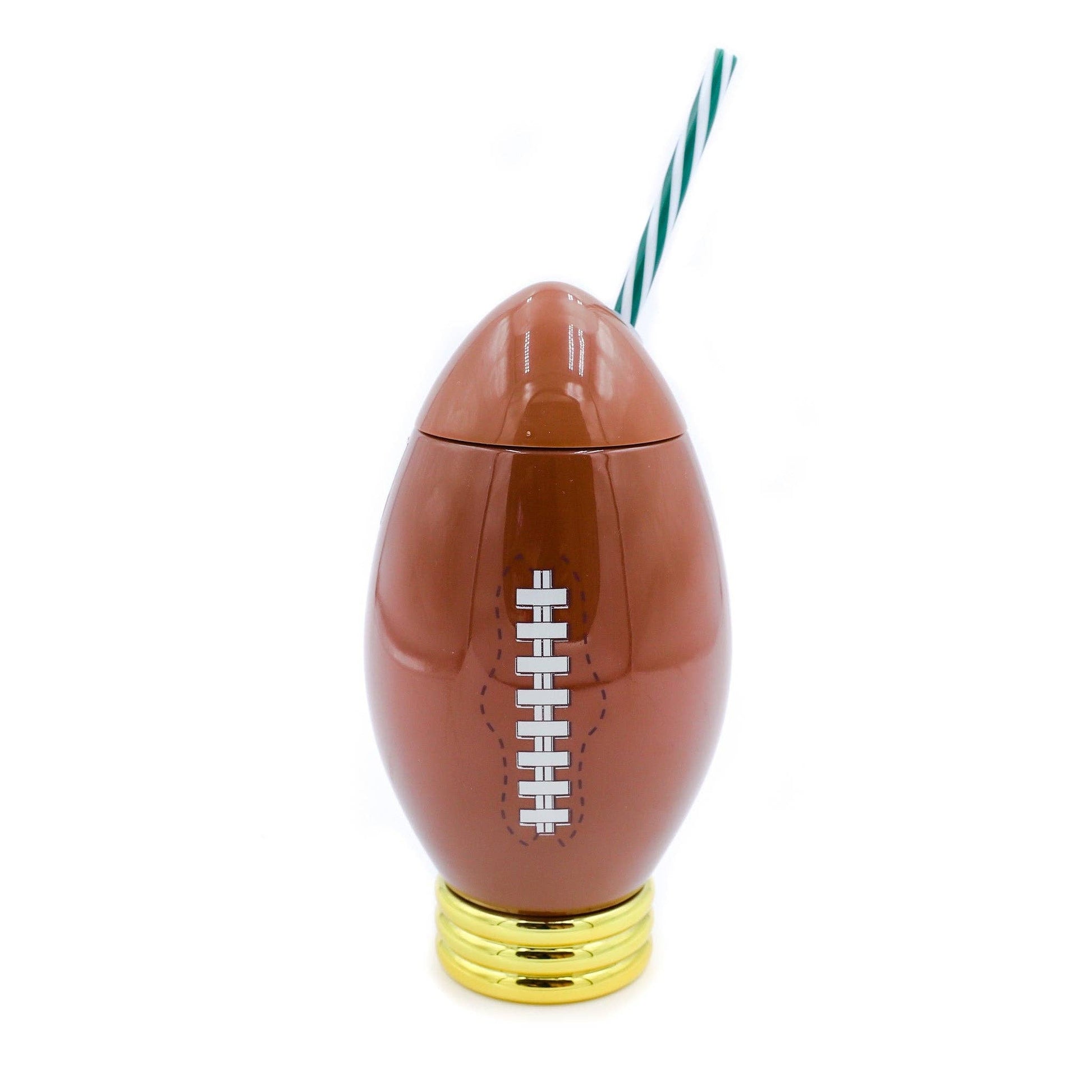 Football-shaped drink container with a straw on a white background
