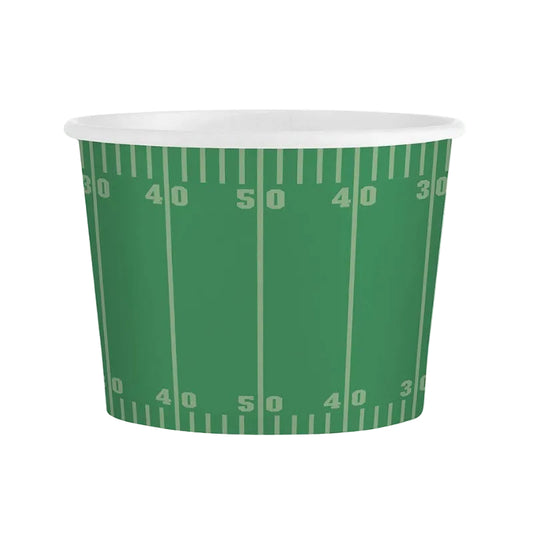 A green paper party cup printed with a football field pattern, featuring white yard lines and numbers, on a plain white background.