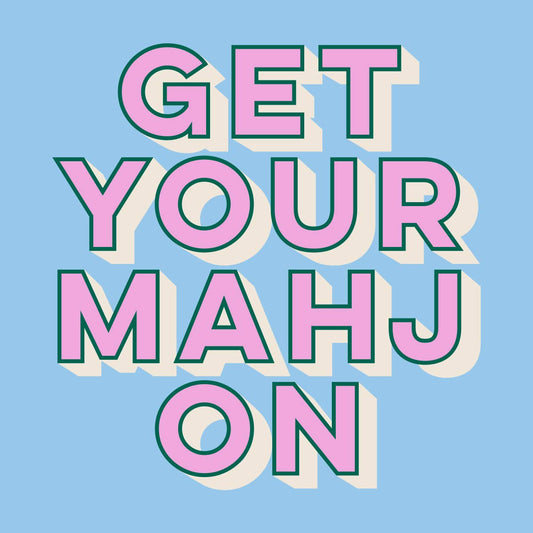 'GET YOUR MAHJ ON' cocktail napkin colorful letters on a blue background