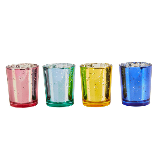 Set of four colorful glass votive candle holders on a white background