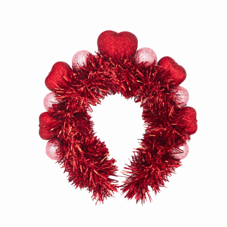 Red tinsel headband with heart shapes on a white background