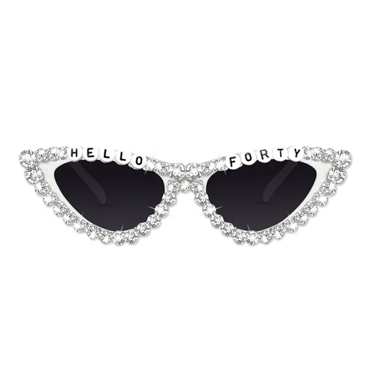 Pair of silver cat eye glasses with hello 40 on a white background