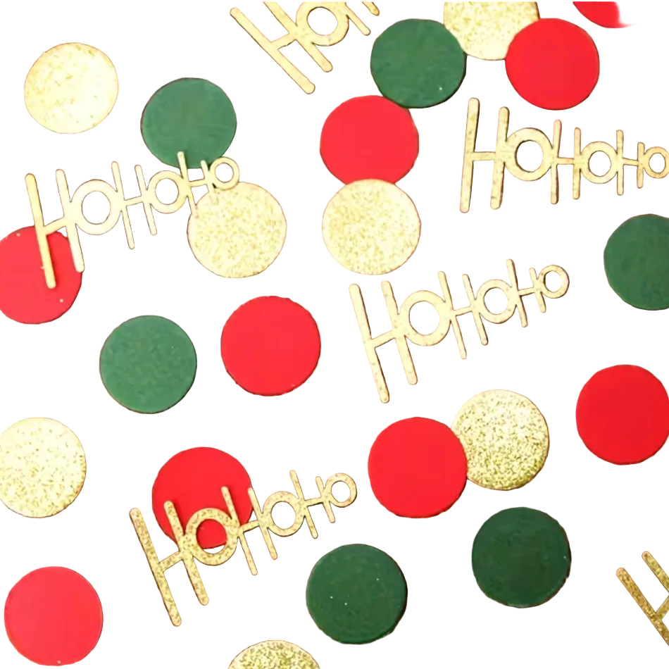 Red, green, and gold Christmas confetti pieces scattered on a white surface, including round red and green dots and gold glitter 'Ho Ho Ho' lettering.