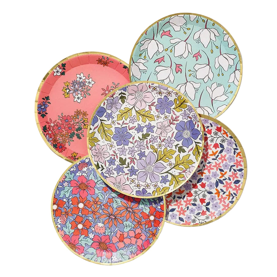 Set of five floral-patterned plates on a white background