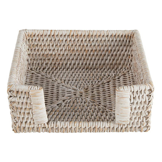 Woven rattan napkin holder on a white background