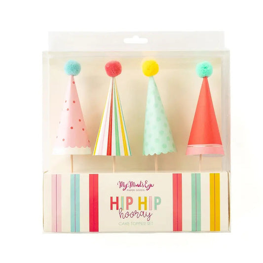 Packaged colorful party hat cake topper on a white background