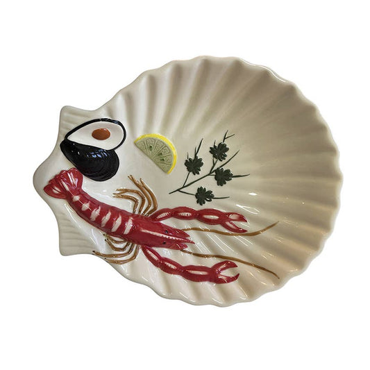 Shell-shaped dish with a lobster and lemon design