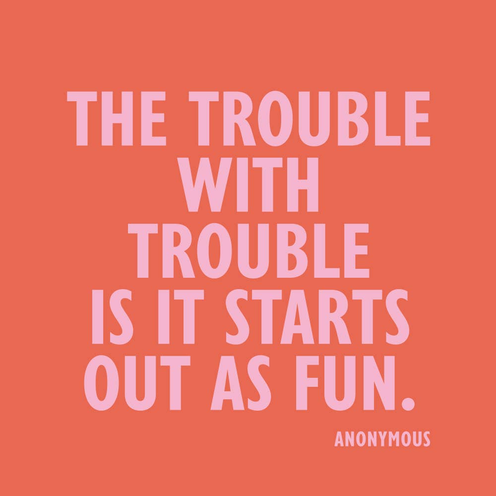 Cocktail napkin with the quote 'The trouble with trouble is it starts out as fun.' on a pink background